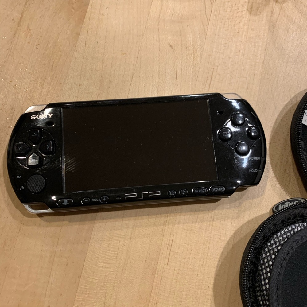 PSP With games and a Charger - Picture 2 of 7